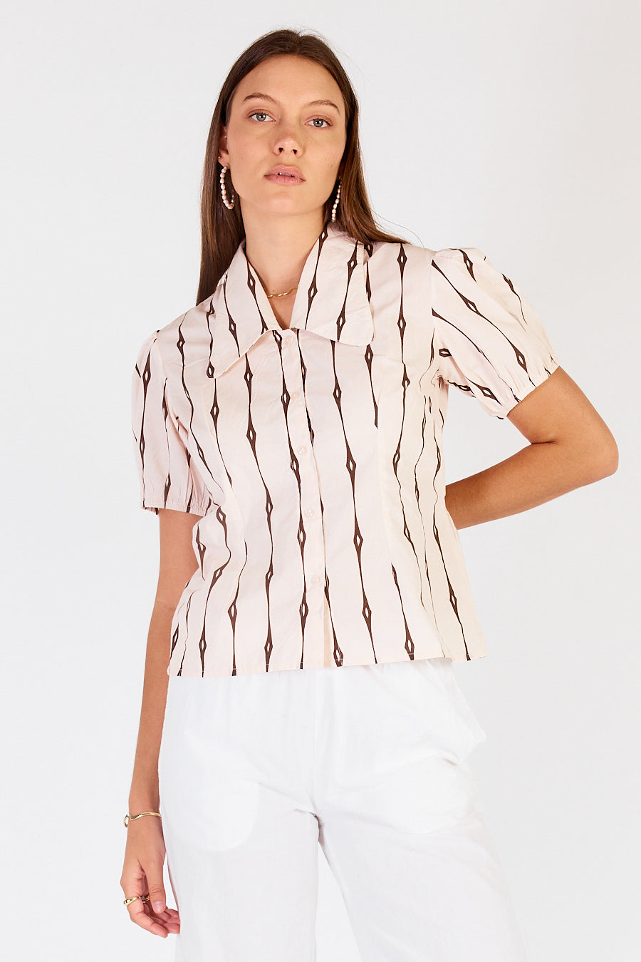 Image of a model wearing Tops. Productname: Cowgirl Surfer Taccia Top Cream in Cream colour by brand - Cowgirl Surfer