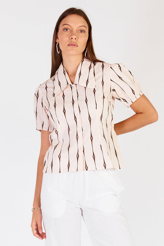 Image of a model wearing Tops. Productname: Cowgirl Surfer Taccia Top Cream in Cream colour by brand - Cowgirl Surfer