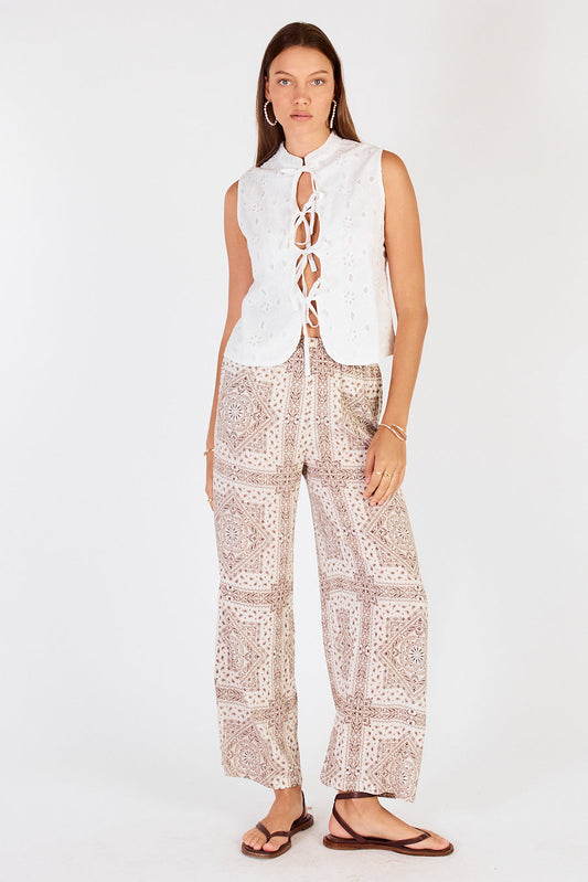Image of a model wearing Pants. Productname: Cowgirl Surfer Nudo Pant Cream in Cream colour by brand - Cowgirl Surfer