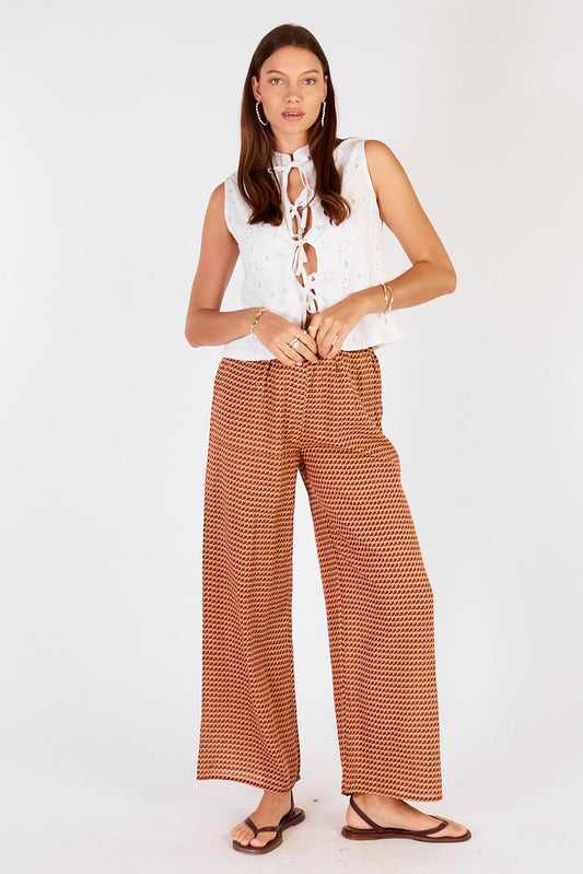 Image of a model wearing Pants. Productname: Cowgirl Surfer Torus Pant Chocolate in Chocolate colour by brand - Cowgirl Surfer