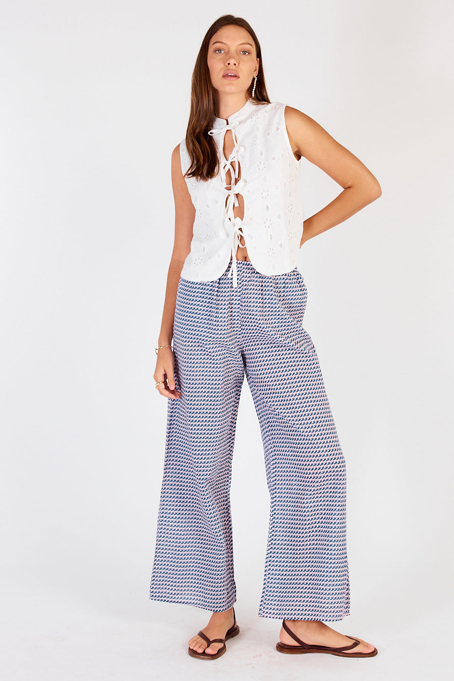 Image of a model wearing Pants. Productname: Cowgirl Surfer Torus Pant Musk in Musk colour by brand - Cowgirl Surfer