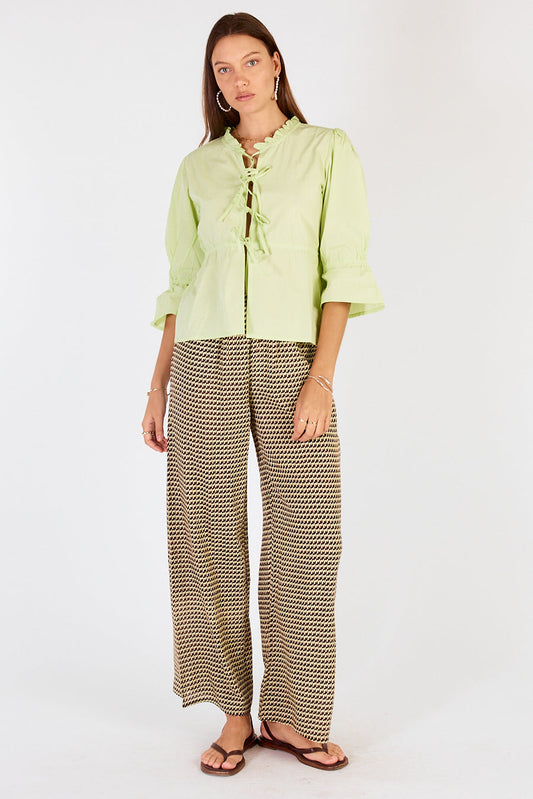 Image of a model wearing Pants. Productname: Cowgirl Surfer Torus Pant Green in Green colour by brand - Cowgirl Surfer