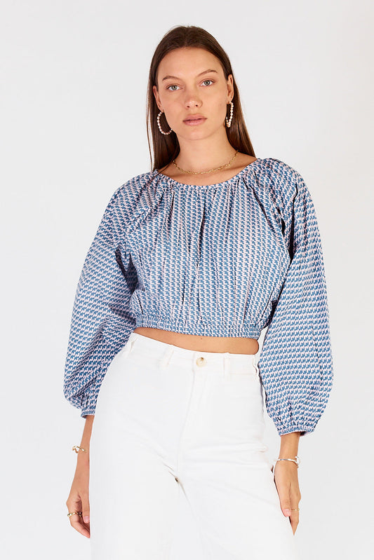 Image of a model wearing Tops. Productname: Cowgirl Surfer Torus Top Musk in Musk colour by brand - Cowgirl Surfer