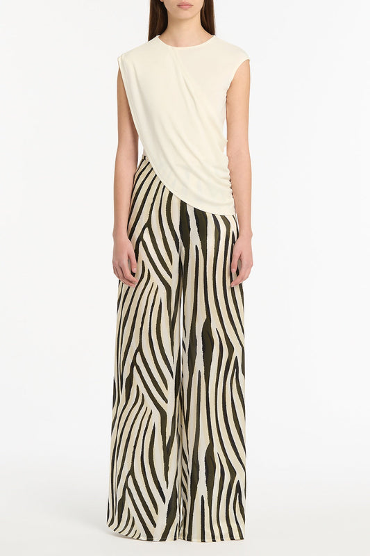 Image of a model wearing Tops. Product name - Cream Jersey Twist Top in Cream colour by brand - Carla Zampatti