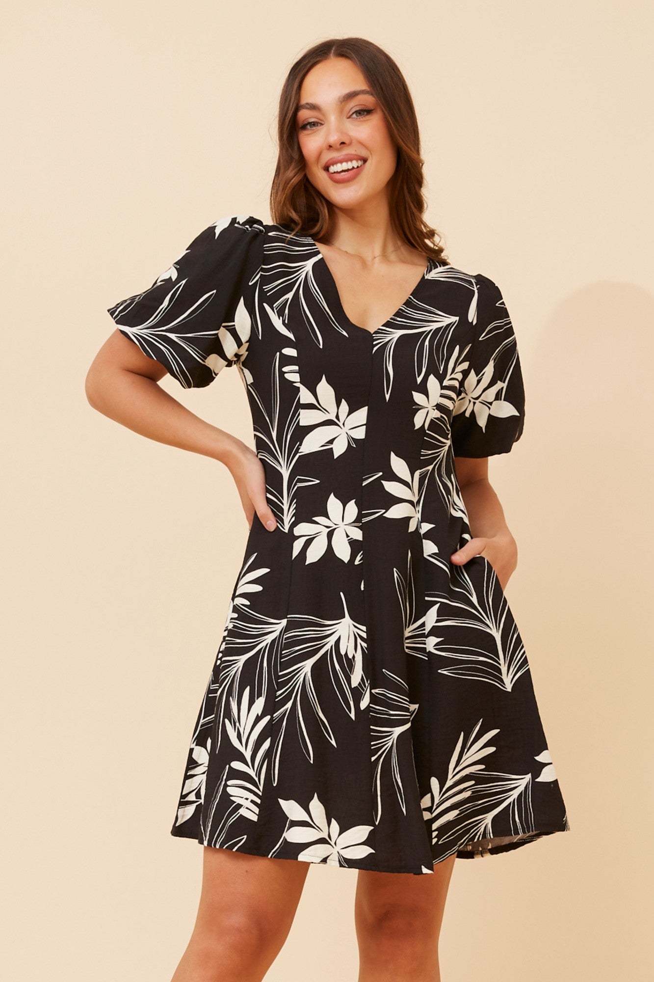 Image of Dresses. Product name - NILA LEAF PRINT SHORT DRESS in Black colour by brand - Caroline Morgan Australia