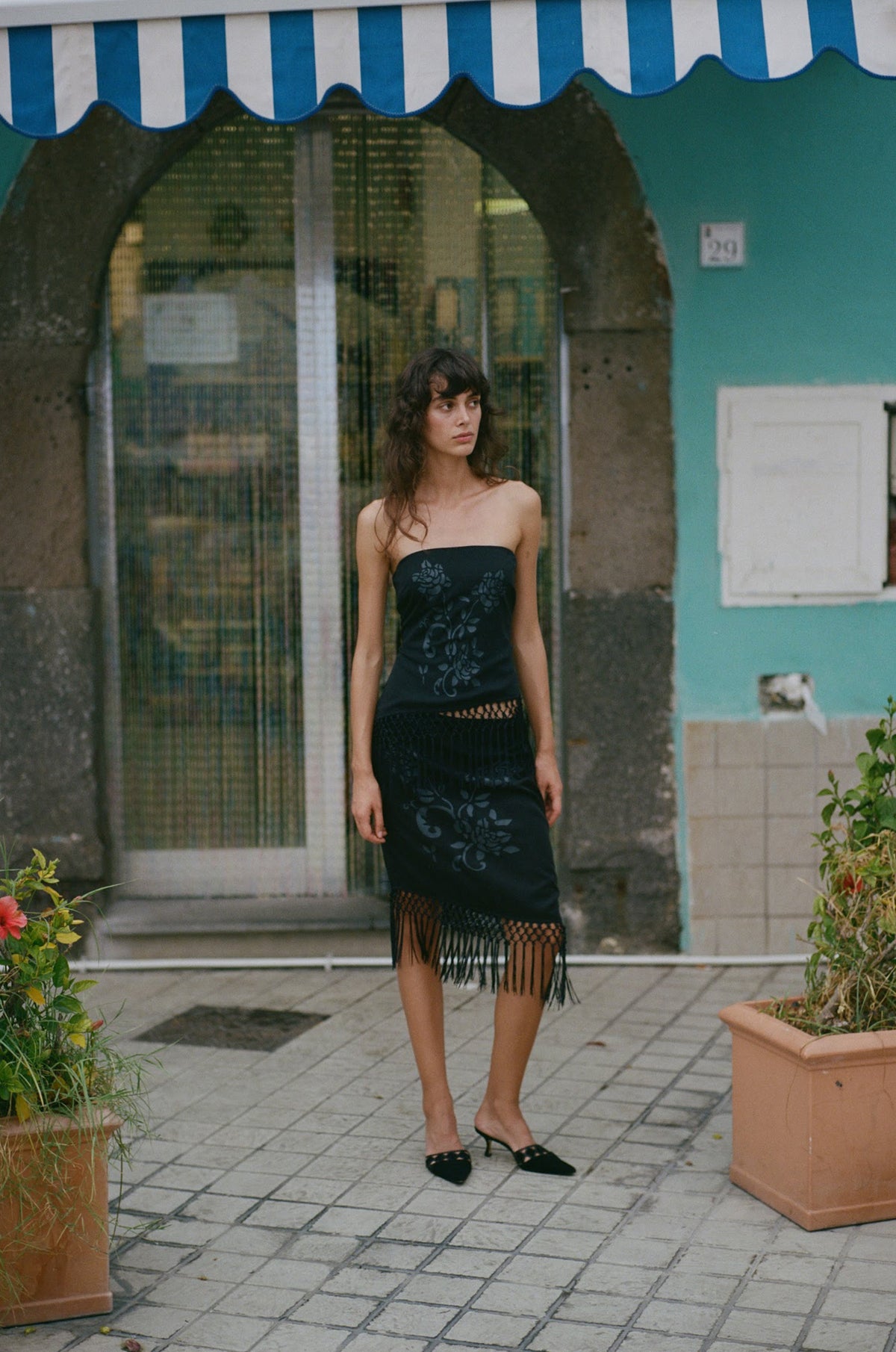 Image of a model wearing Tops. Product name - Daria Top in Black colour by brand - With Jéan