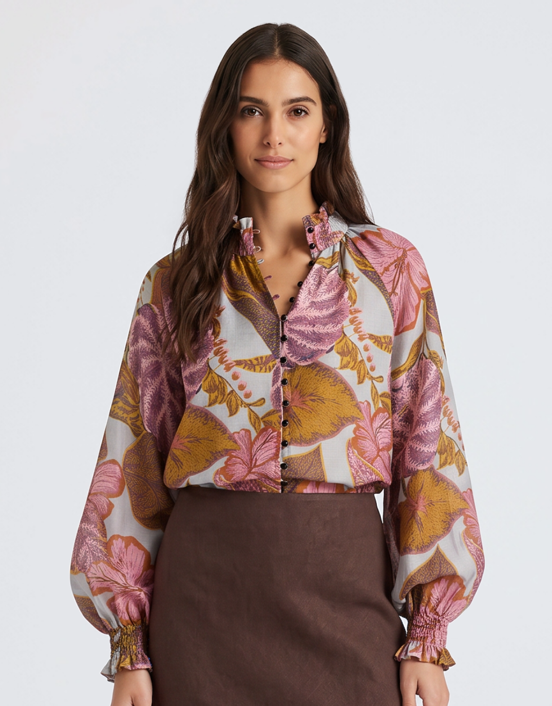 Image of a model wearing Tops. Product name - Daria Shirred Blouse Leaf Print in Leaf Print colour by brand - Fate and Becker