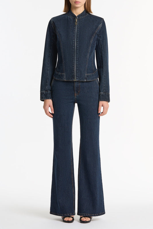 Image of a model wearing Pants. Product name - Dark Indigo Bootleg Denim Jeans in Blue colour by brand - Carla Zampatti
