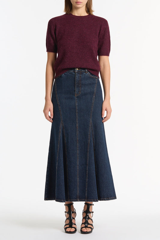 Image of a model wearing Skirts. Product name - Dark Indigo Panel Denim Skirt in Blue colour by brand - Carla Zampatti