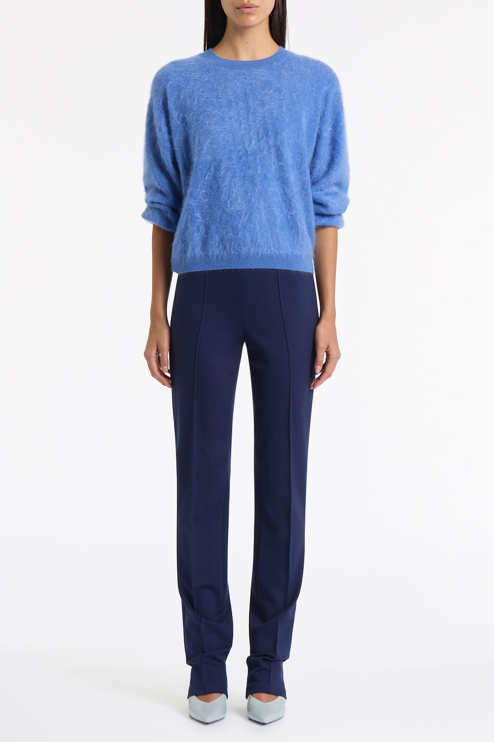 Image of a model wearing Pants. Product name - Deep Blue Ponte Pinstitch Slim Leg Pant in Blue colour by brand - Carla Zampatti