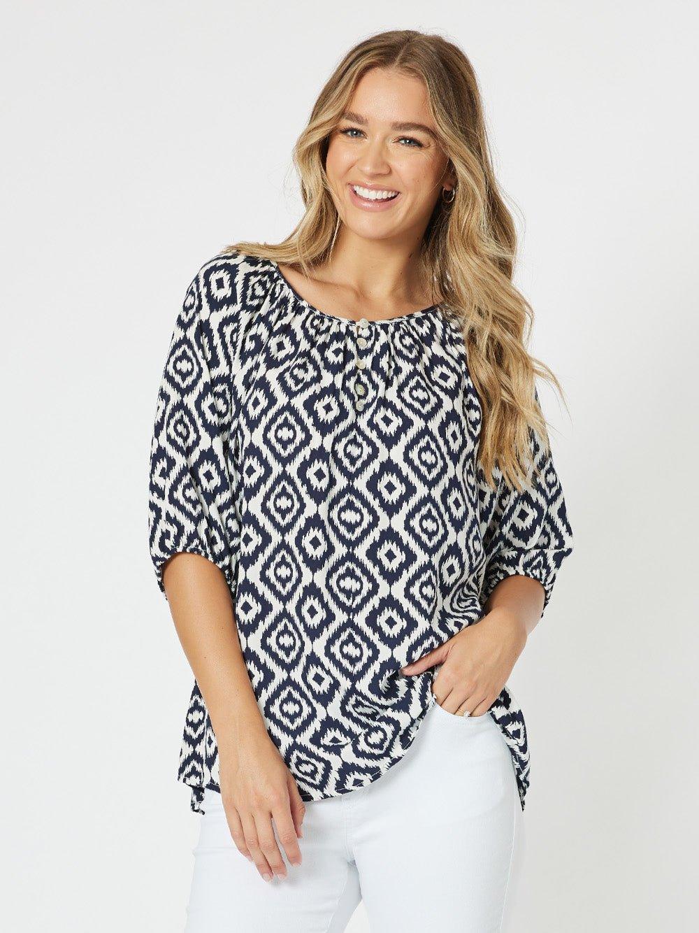 Image of a model wearing Outerwear. Product name - Diamond Tunic Top Marine in Marine colour by brand - Threadz