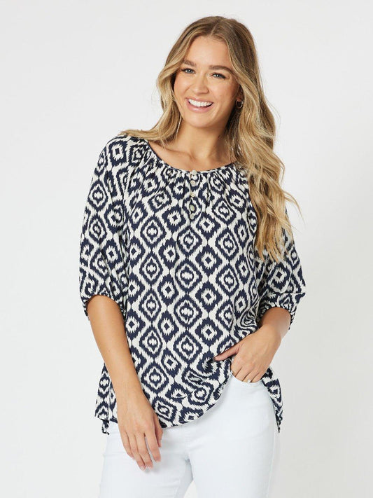 Image of a model wearing Outerwear. Product name - Diamond Tunic Top Marine in Marine colour by brand - Threadz