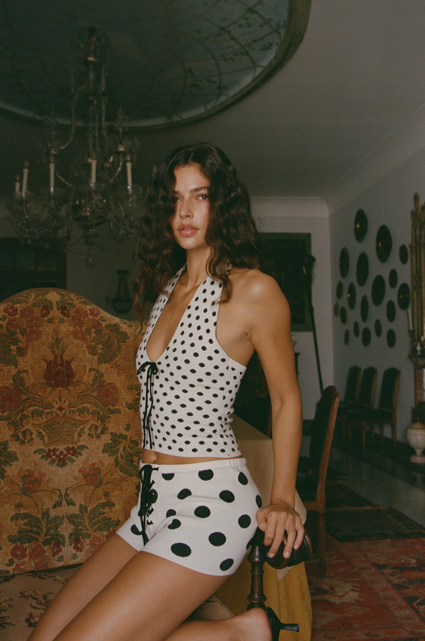 Image of a model wearing Tops. Product name - Dottie Top in Black colour by brand - With Jéan