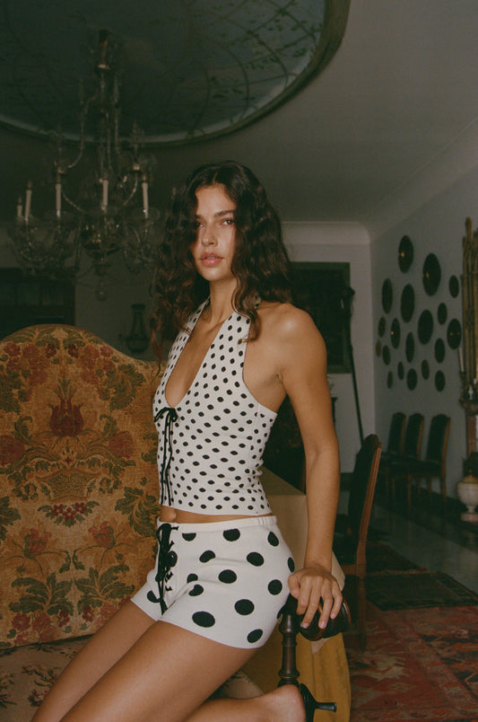 Image of a model wearing Tops. Product name - Dottie Top in Black colour by brand - With Jéan