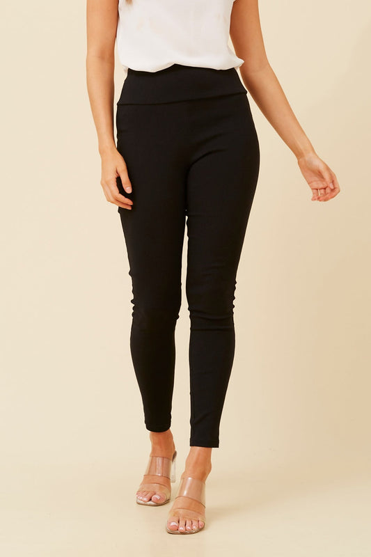 Image of a model wearing Pants. Product name - KIMIA SKINNY PANTS in Black colour by brand - Caroline Morgan Australia