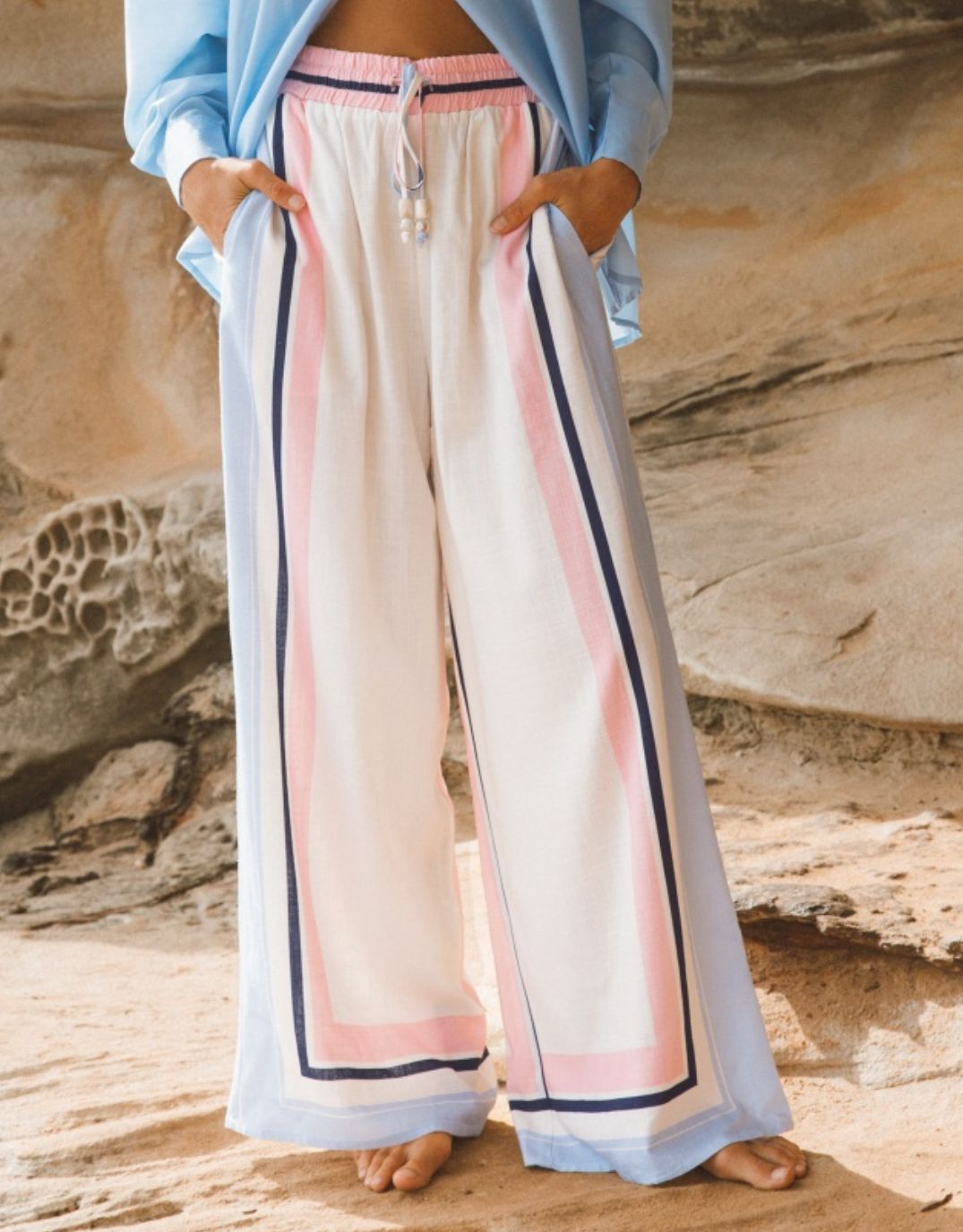 Image of a model wearing Pants. Productname: Clarabelle Wide Leg Pant - in Multi colour by brand - Ebby and I