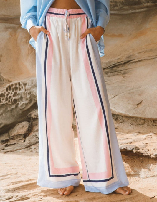 Image of a model wearing Pants. Productname: Clarabelle Wide Leg Pant - in Multi colour by brand - Ebby and I