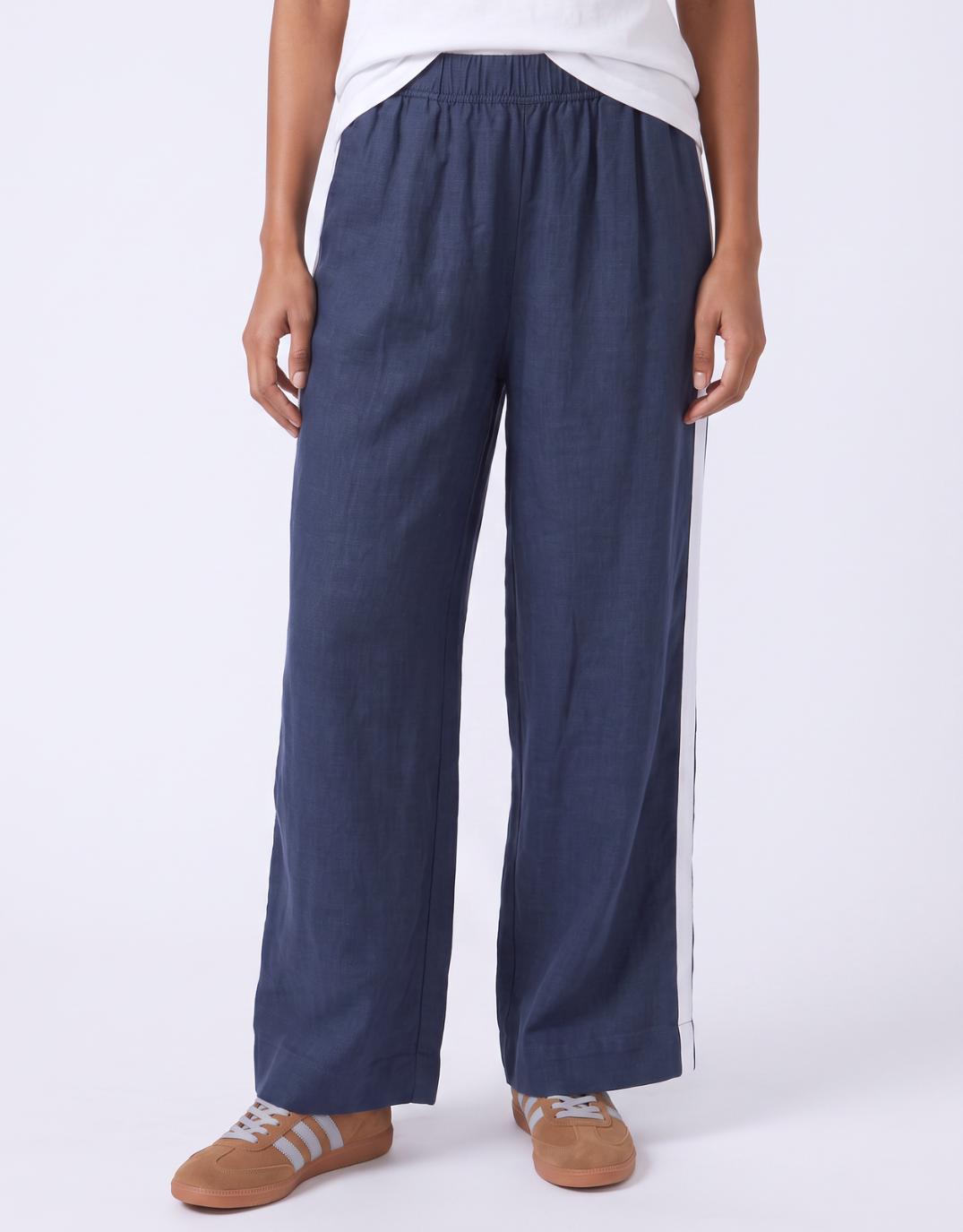 Image of a model wearing Pants. Product name - Elemental Pant Navy in Navy colour by brand - Foxwood