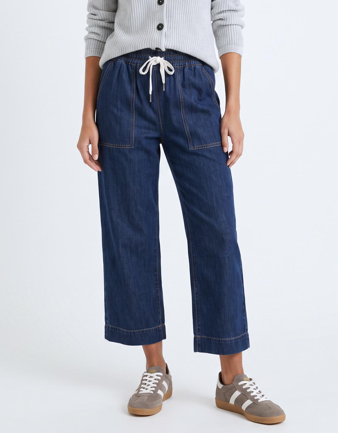 Image of a model wearing Pants. Product name - Greta Slim Leg Denim Pant Sapphire in Blue colour by brand - Elm