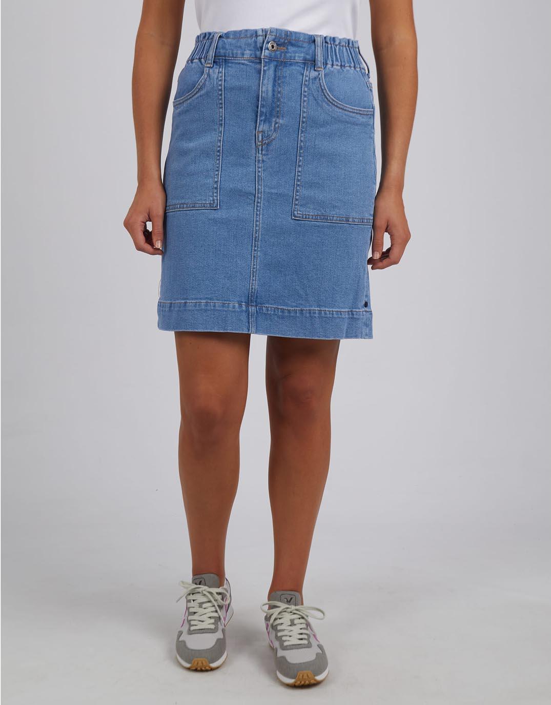 Image of a model wearing Skirts. Productname: Atlas Denim Skirt - in Blue colour by brand - Elm