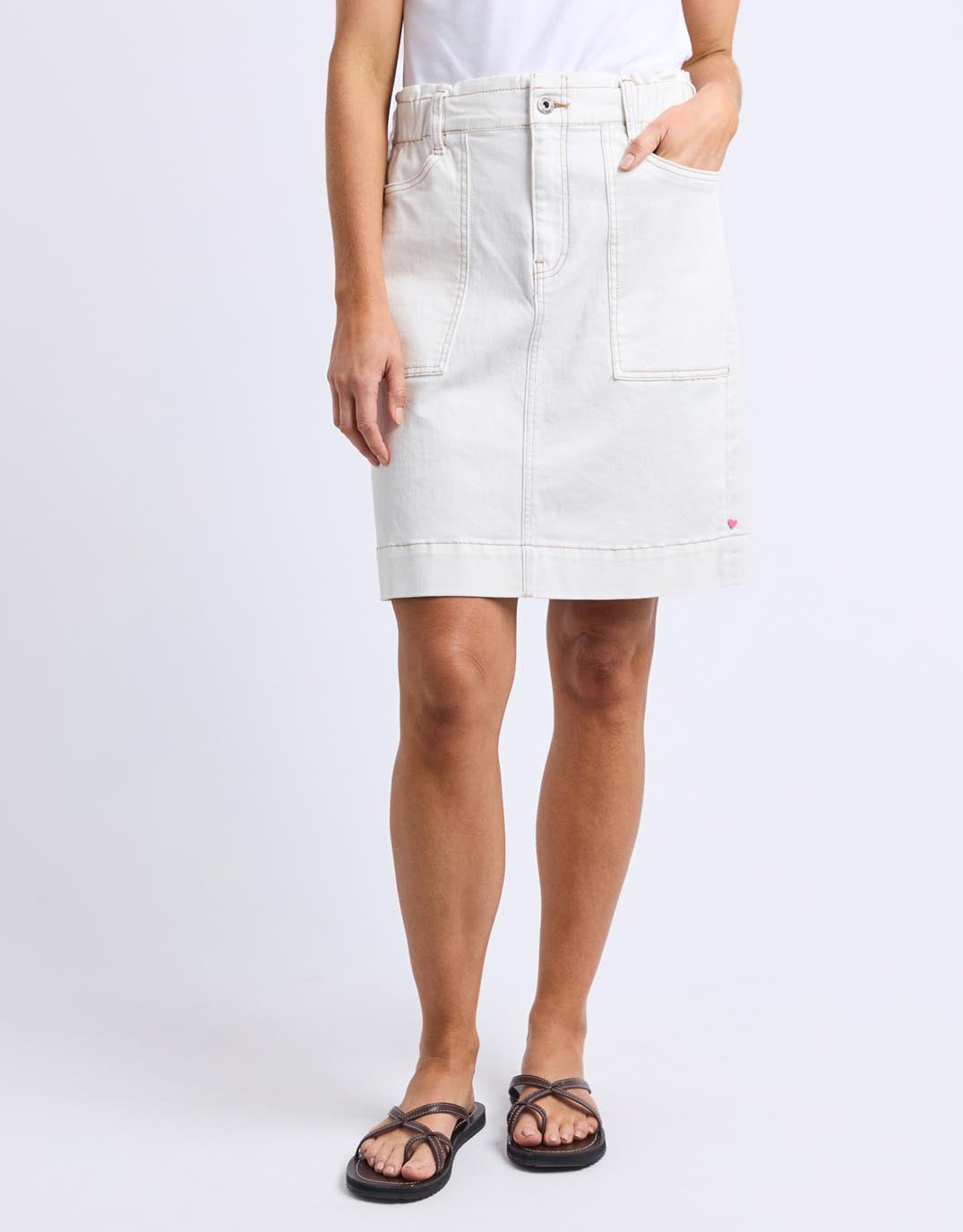 Image of a model wearing Skirts. Productname: Atlas Denim Skirt - in Vintage White colour by brand - Elm