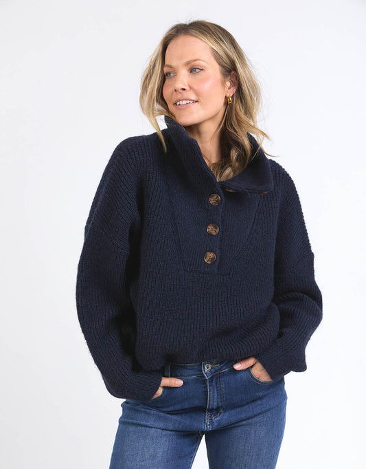 Image of a model wearing Outerwear. Productname: Bron Button Knit - in Navy colour by brand - Elm
