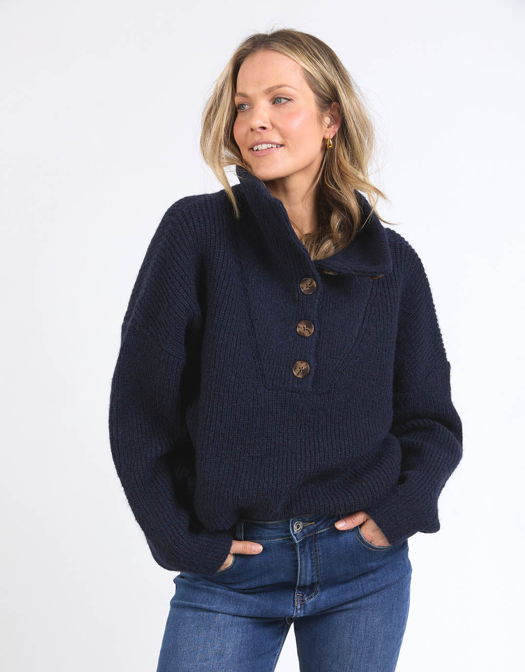 Image of a model wearing Outerwear. Product name - Bron Button Knit Navy in Navy colour by brand - Elm
