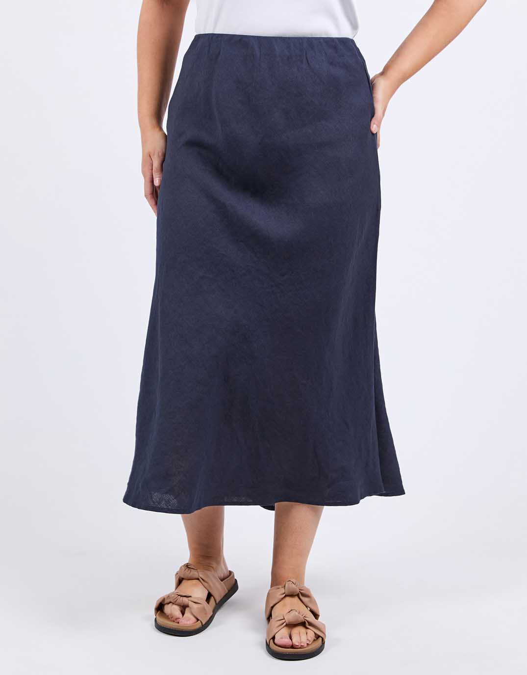 Image of a model wearing Skirts. Productname: Eleni Linen Skirt - in Dark Sapphire colour by brand - Elm