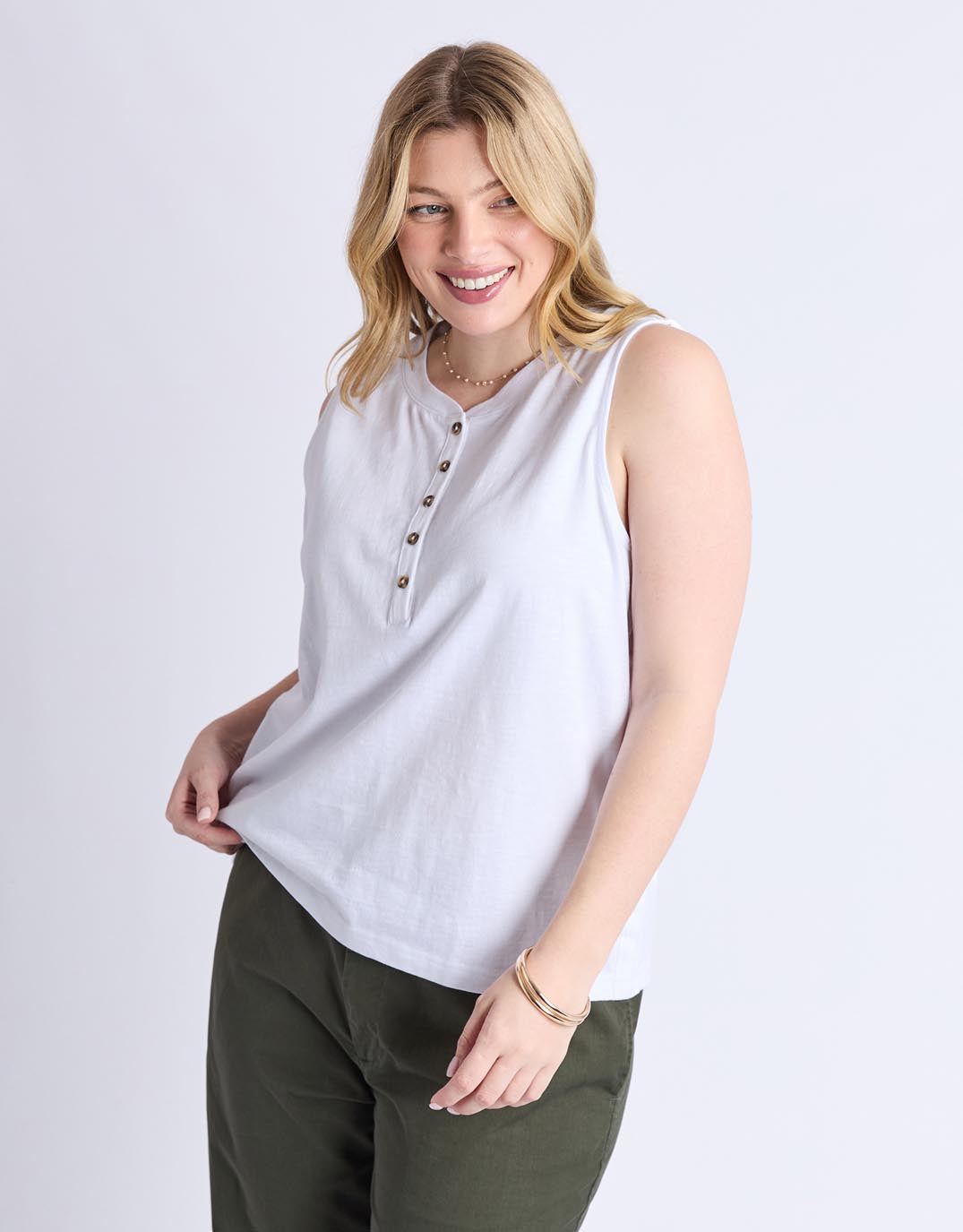 Image of a model wearing Tops. Productname: Elysian Tank - in White colour by brand - Elm