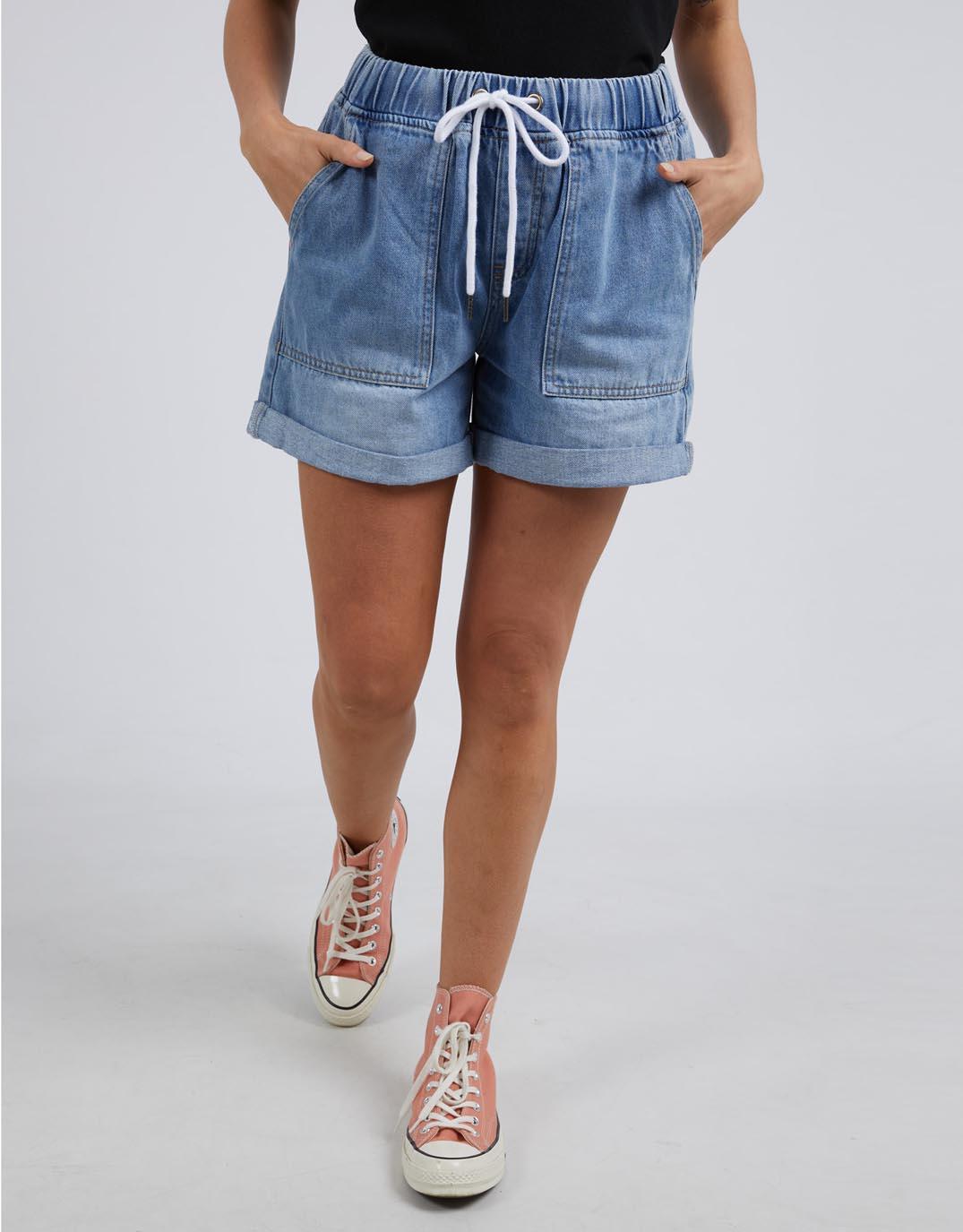 Image of a model wearing Shorts. Productname: Emma Relaxed Denim Short - in Blue colour by brand - Elm
