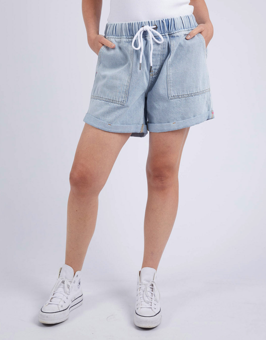 Image of a model wearing Shorts. Productname: Emma Relaxed Denim Short - in Light Blue Wash colour by brand - Elm