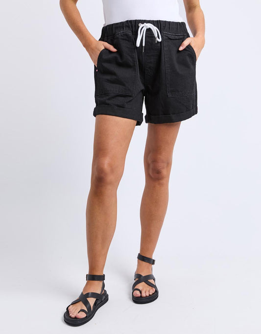 Image of a model wearing Shorts. Productname: Emma Relaxed Short - in Black colour by brand - Elm