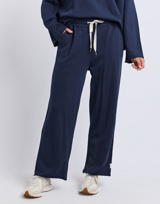 Image of a model wearing Pants. Productname: Gab Trackpant - in Dark Sapphire colour by brand - Elm