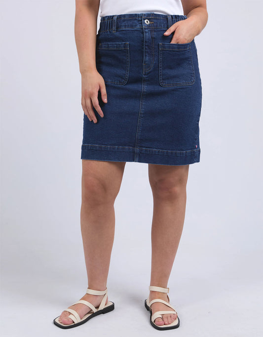 Image of a model wearing Skirts. Productname: Lennox Denim Skirt - in Dark Blue Wash colour by brand - Elm