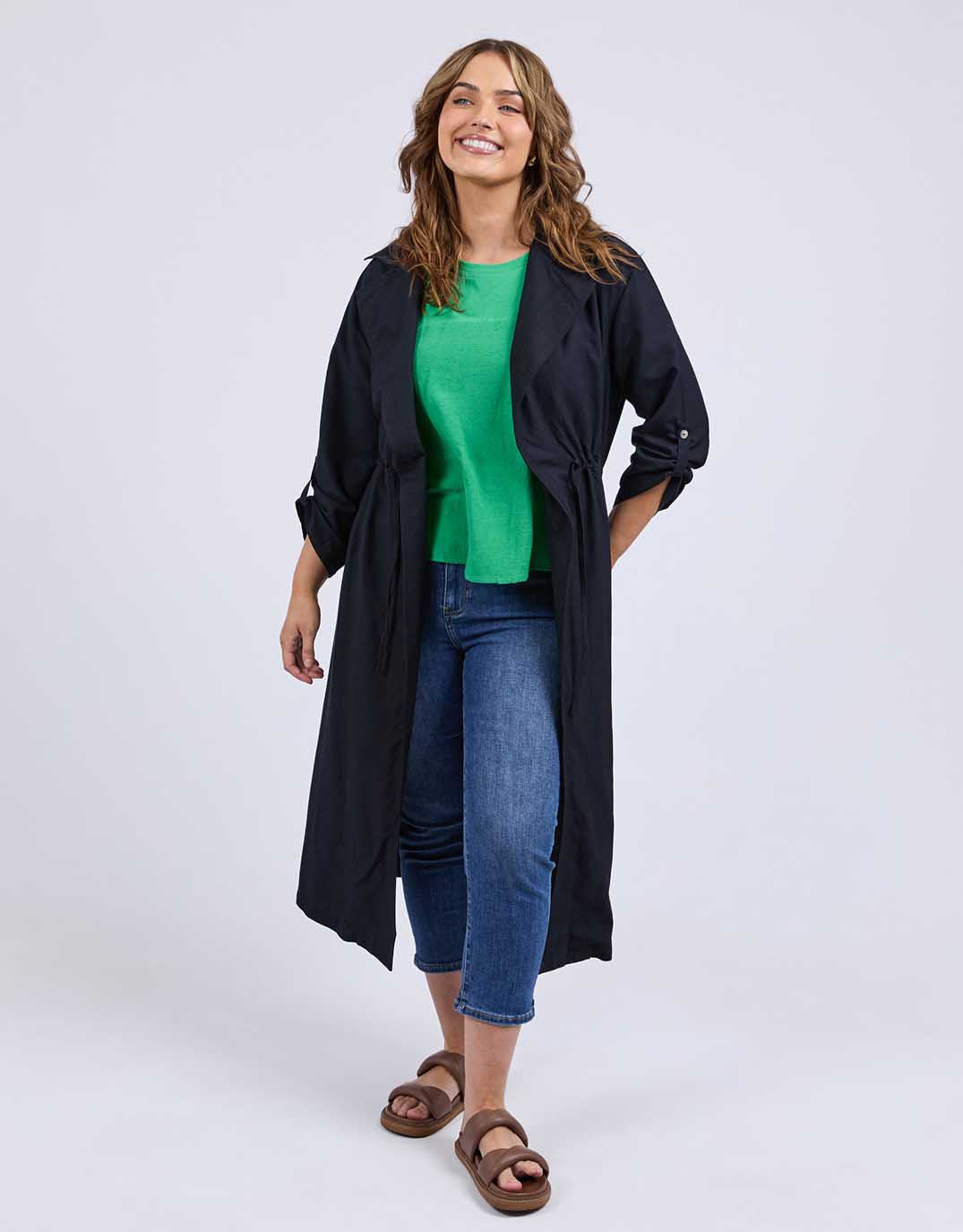 Image of a model wearing Outerwear. Productname: Linen Trench - in Dark Sapphire colour by brand - Elm