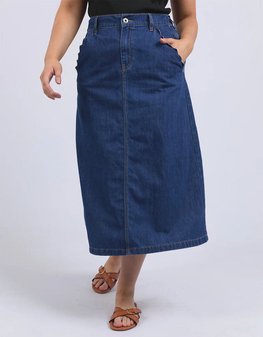 Image of a model wearing Skirts. Productname: Scallop Edge Denim Skirt - in Mid Blue Wash colour by brand - Elm