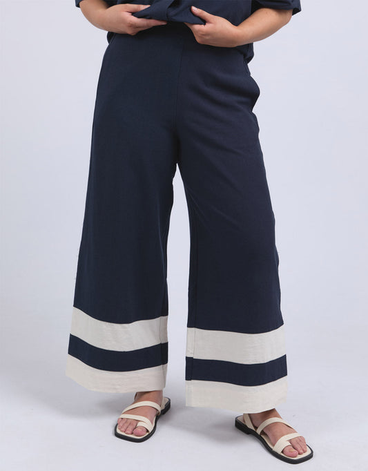 Image of a model wearing Pants. Productname: Scarlet Pant - in Navy Stripe colour by brand - Elm
