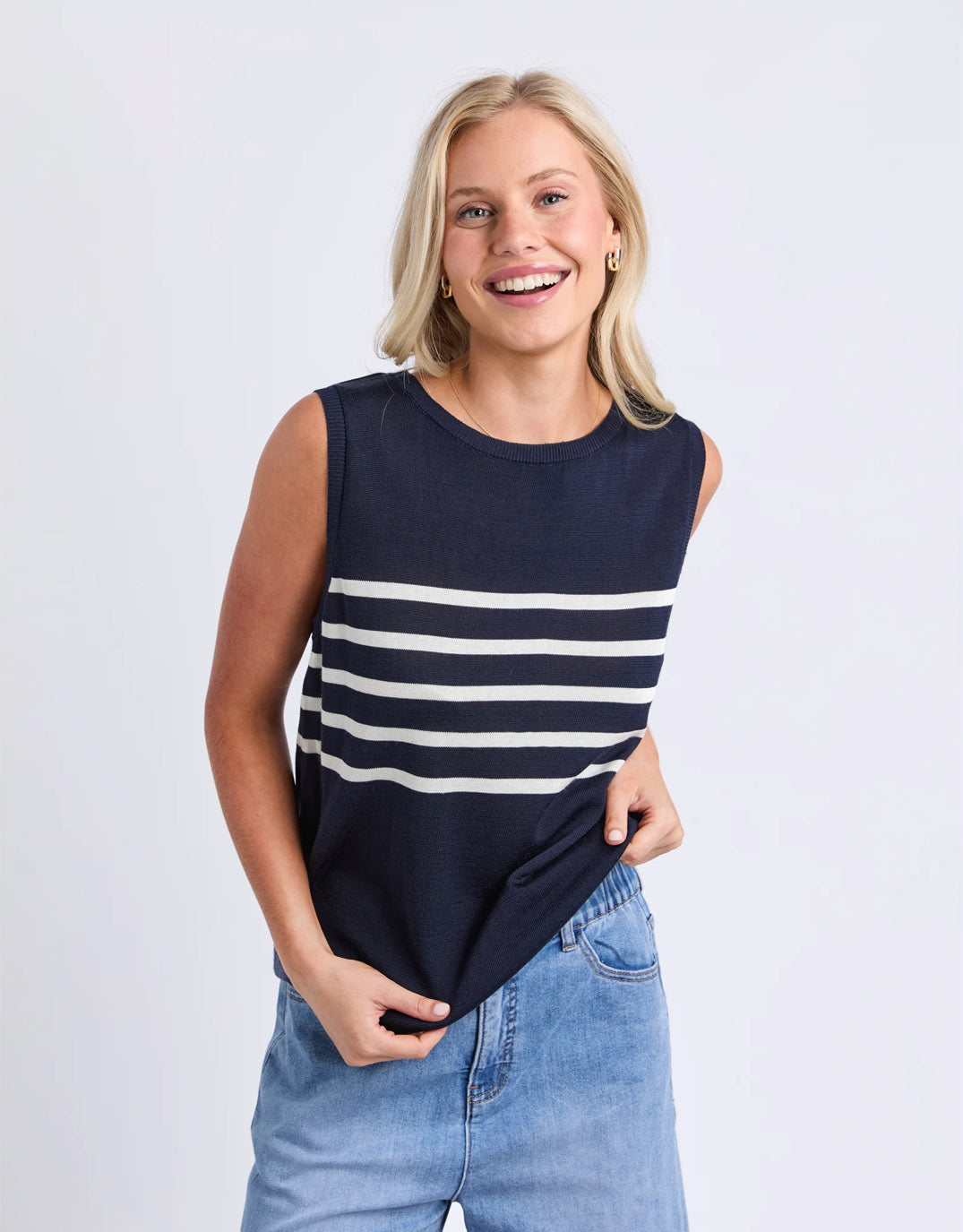 Image of a model wearing Outerwear. Product name - Striped Knit Tank Navy in Navy colour by brand - Elm