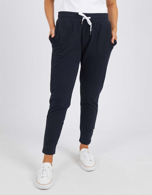 Image of a model wearing Pants. Product name - The Lobby Pant Black in Black colour by brand - Elm