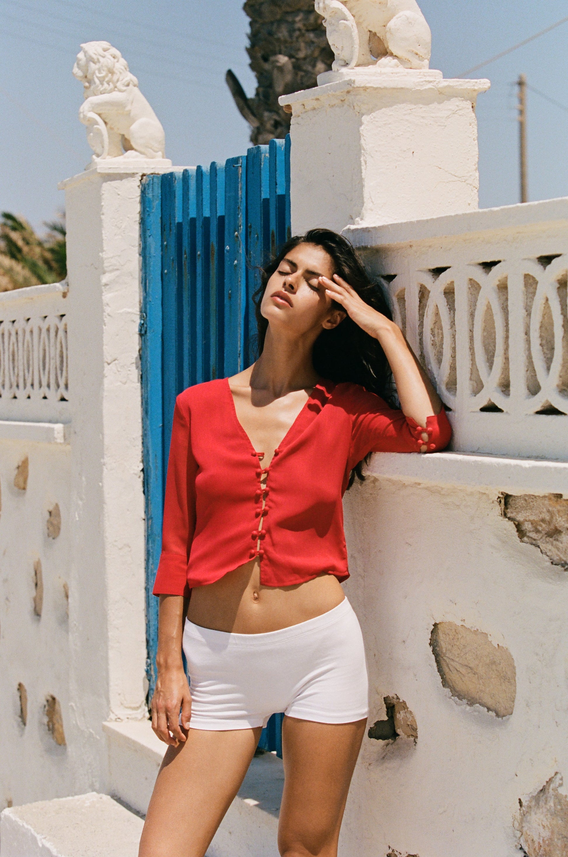 Image of a model wearing Tops. Product name - Elsie Top in Red colour by brand - With Jéan