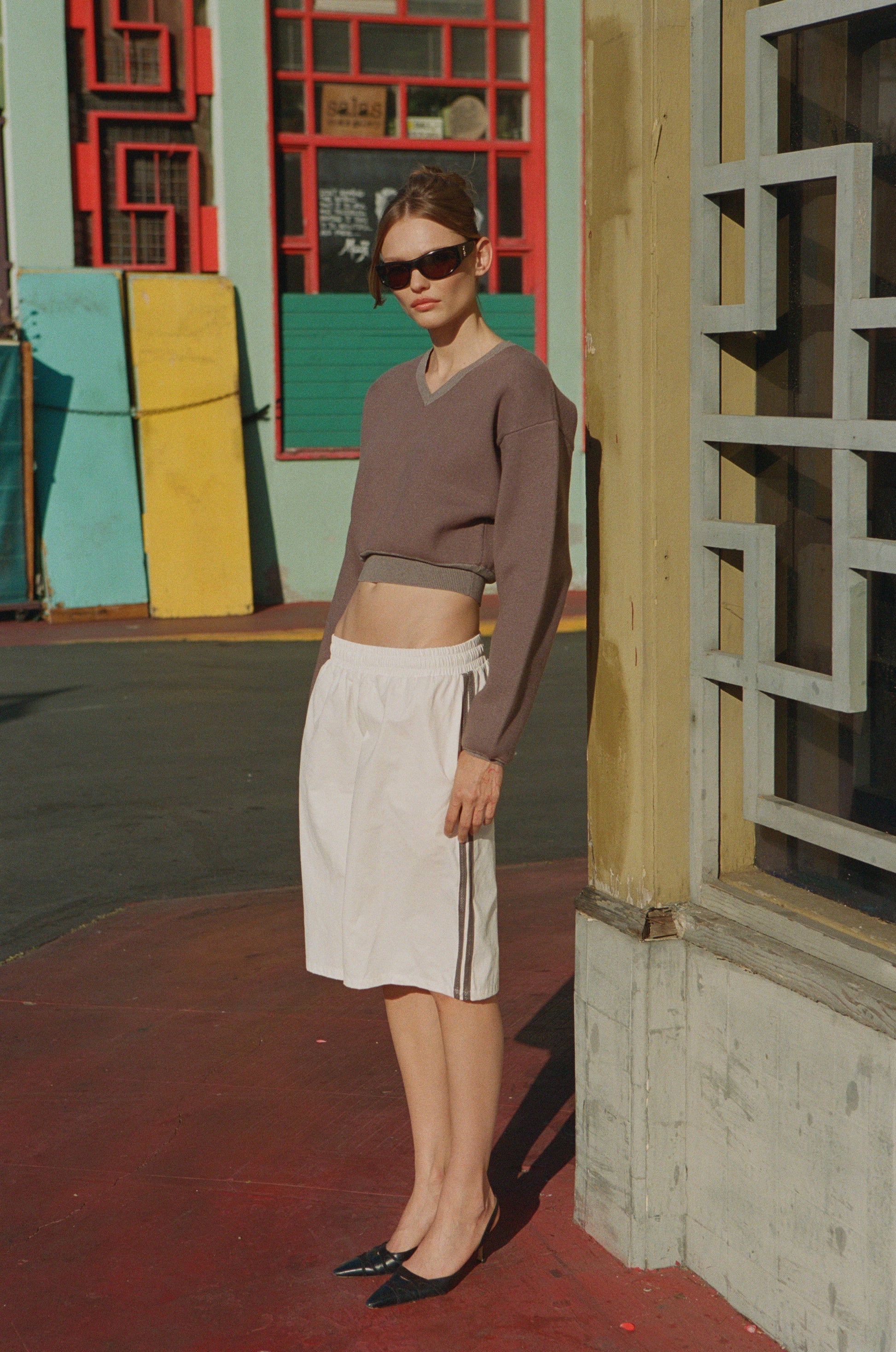 Image of a model wearing Outerwear. Product name - Evie Sweater in Grey colour by brand - With Jéan
