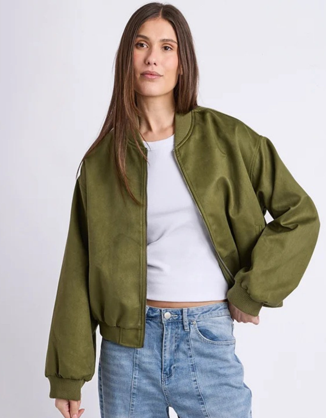 Image of a model wearing Outerwear. Product name - Evie Suede Bomber Olive in Olive colour by brand - Foxwood