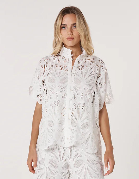 Image of a model wearing Tops. Productname: Elara Broderie Blouse - in Ivory colour by brand - Fate and Becker