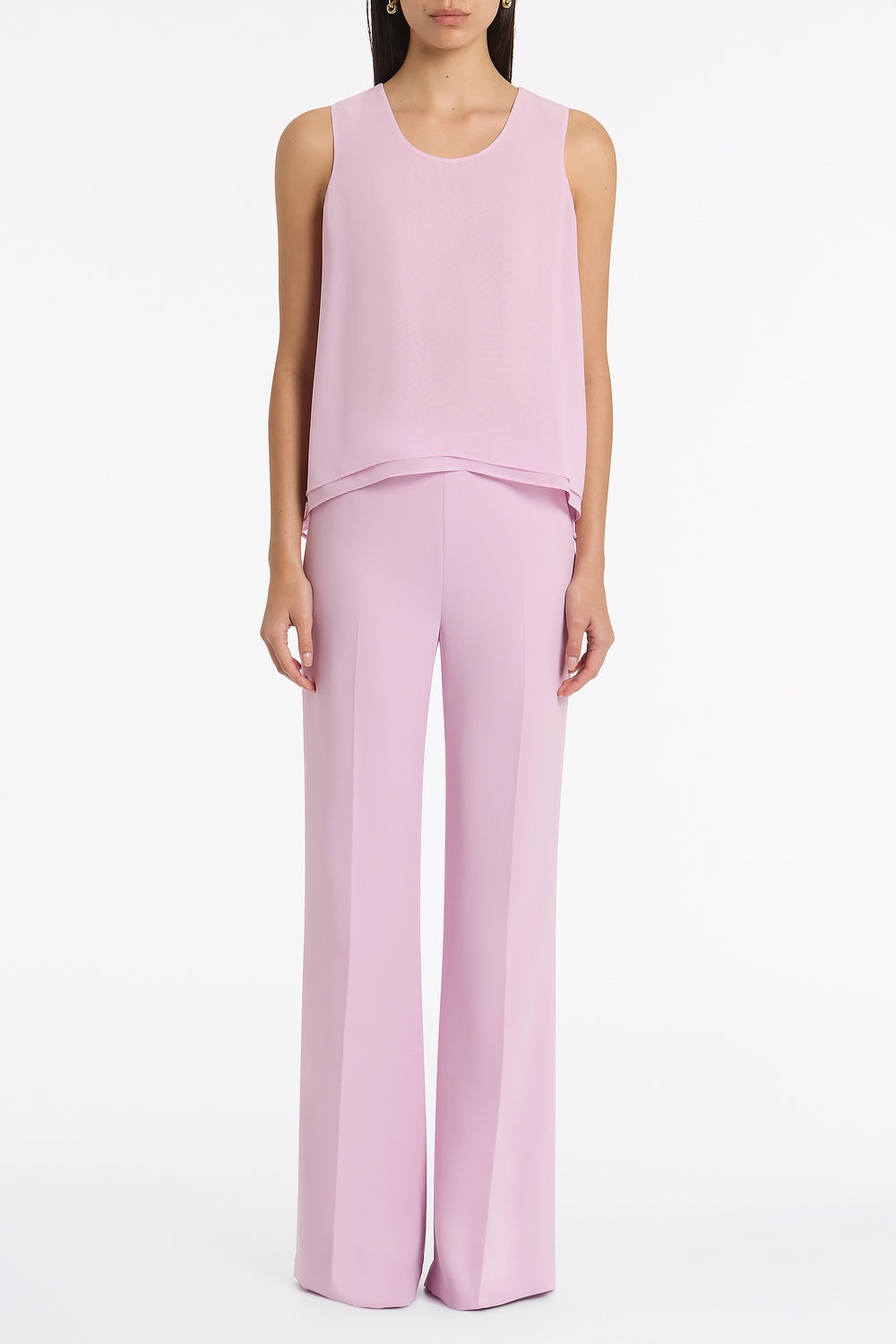 Image of a model wearing Tops. Product name - Floss Georgette Tiered Cami in Pink colour by brand - Carla Zampatti
