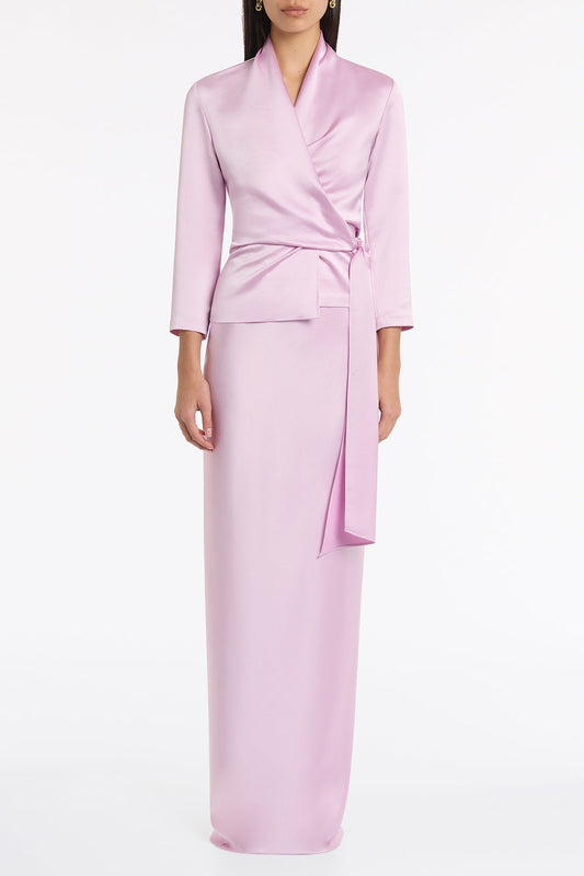 Image of a model wearing Skirts. Product name - Floss Lustre Satin Bias Skirt in Pink colour by brand - Carla Zampatti