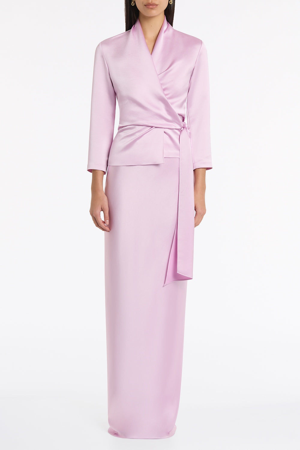 Image of a model wearing Tops. Product name - Floss Lustre Satin Wrap Top in Pink colour by brand - Carla Zampatti