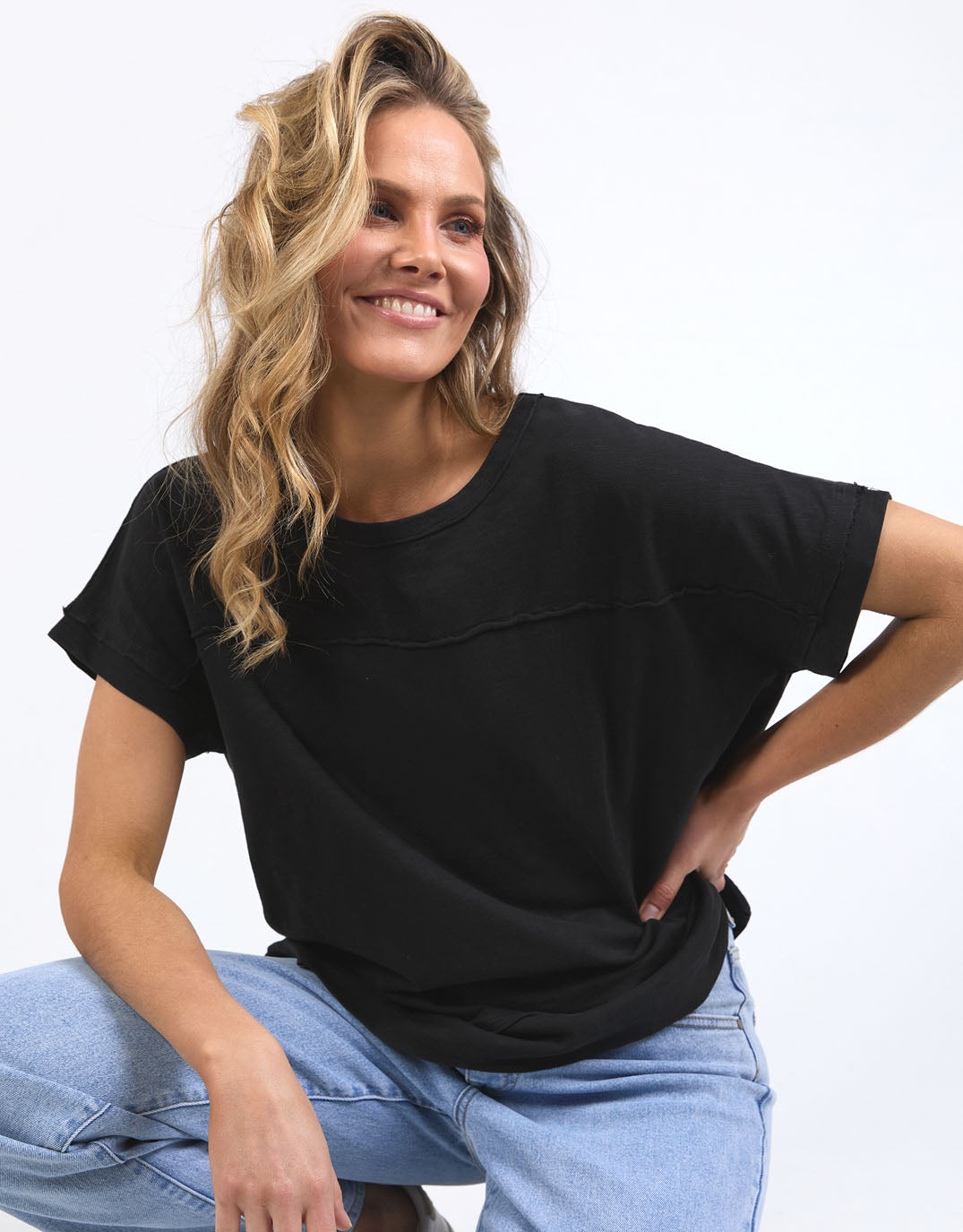 Image of a model wearing Tops. Productname: Allison Tee - in Black colour by brand - Foxwood