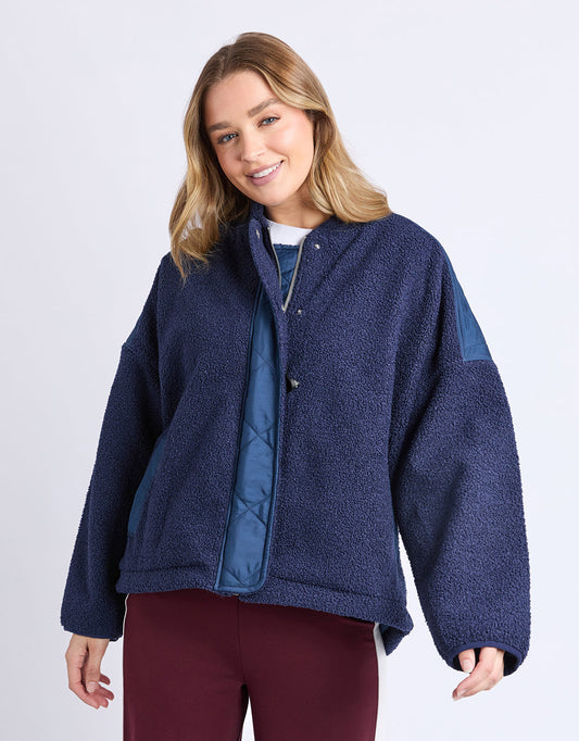 Image of a model wearing Outerwear. Product name - Arizona Fleece Zip Thru Navy in Navy colour by brand - Foxwood