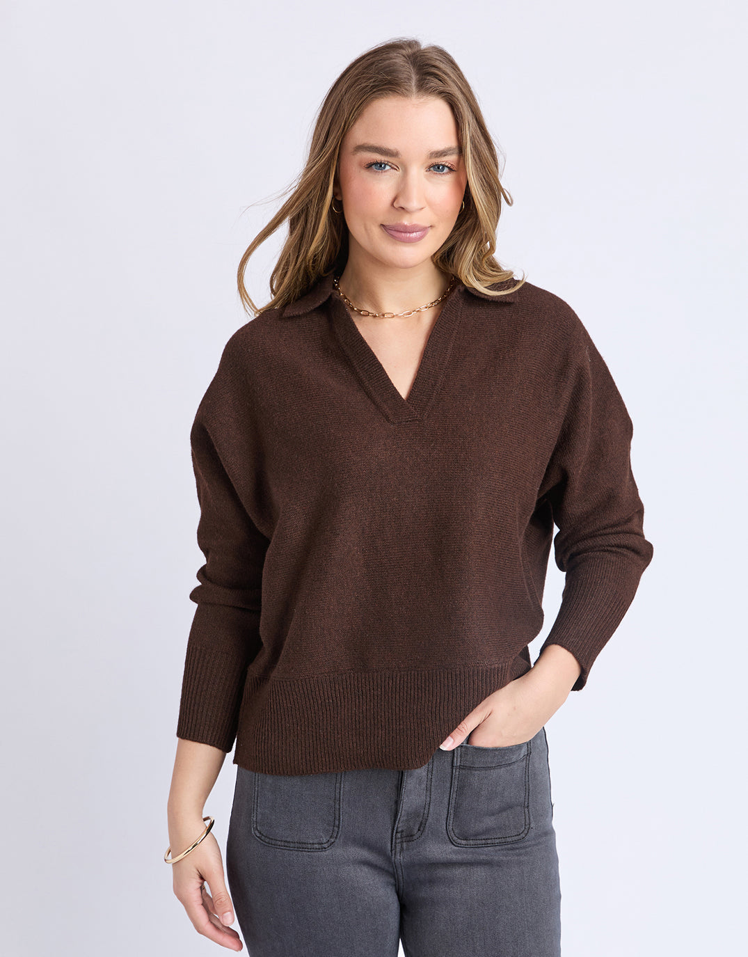 Image of a model wearing Outerwear. Product name - Elea Knit Polo Coffee in Coffee colour by brand - Foxwood