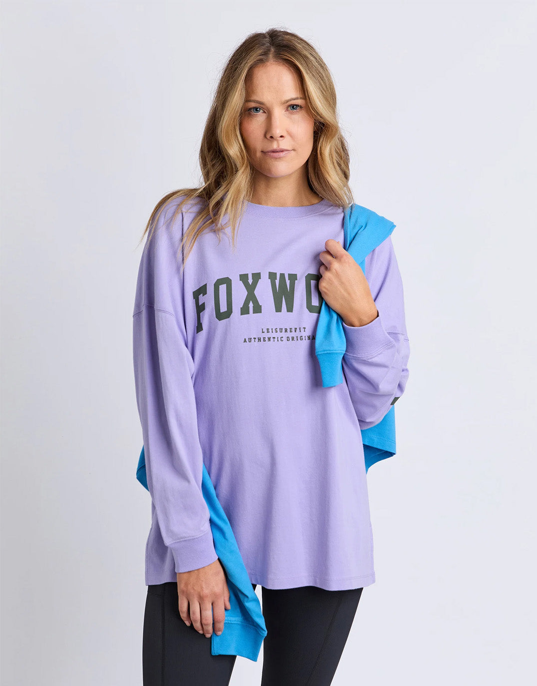 Image of a model wearing Tops. Product name - Interval Long Sleeve Lavender / Khaki in Lavender / Khaki colour by brand - Foxwood